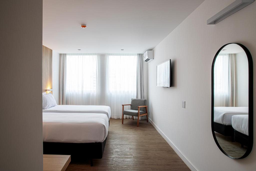 Sooz Hotel Collection客房内的一张或多张床位