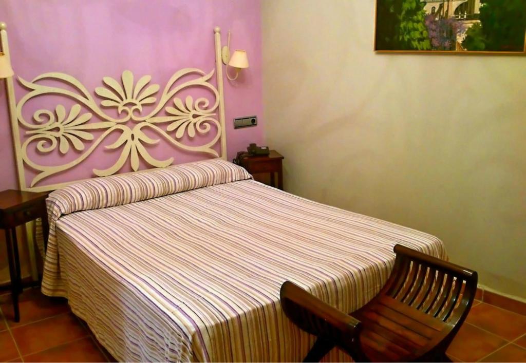 阿尔安达卢斯赫雷斯酒店客房内的一张或多张床位
