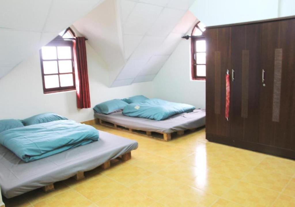 NHỚ House IV客房内的一张或多张床位