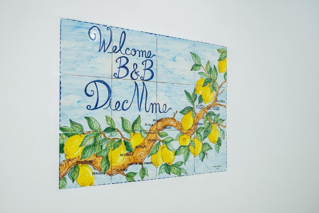 维耶特里B&B DieMme Amalfi Coast的带有柠檬树的标志,上面写着欢迎兄弟爸爸妈妈的话
