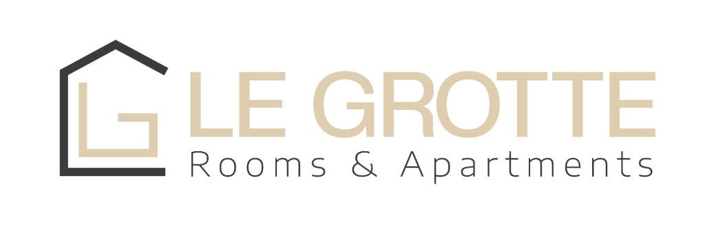 卡梅拉诺Affittacamere Le Grotte - Le Grotte Rooms & Apartments的团体客房和公寓的标志