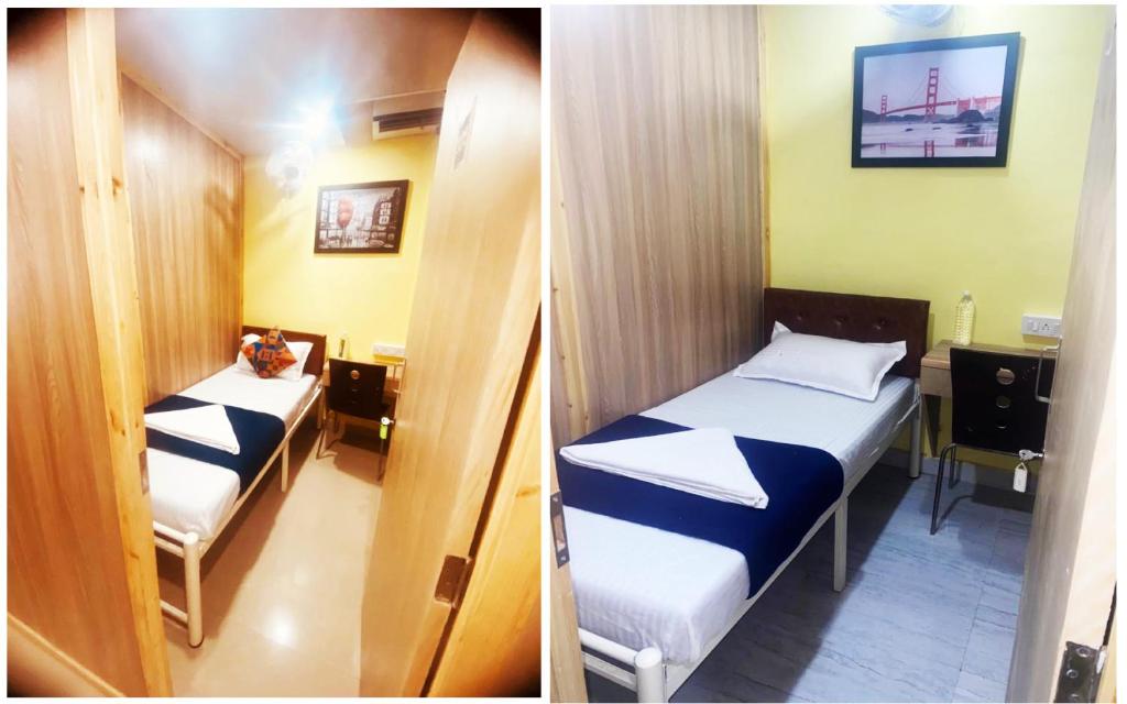 孟买Royal Cabin Stay的一间小房间,内设两张床