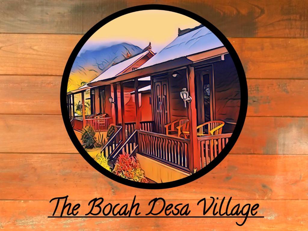 塔巴南The Bocah Desa Village的木墙上的海滩村落标志