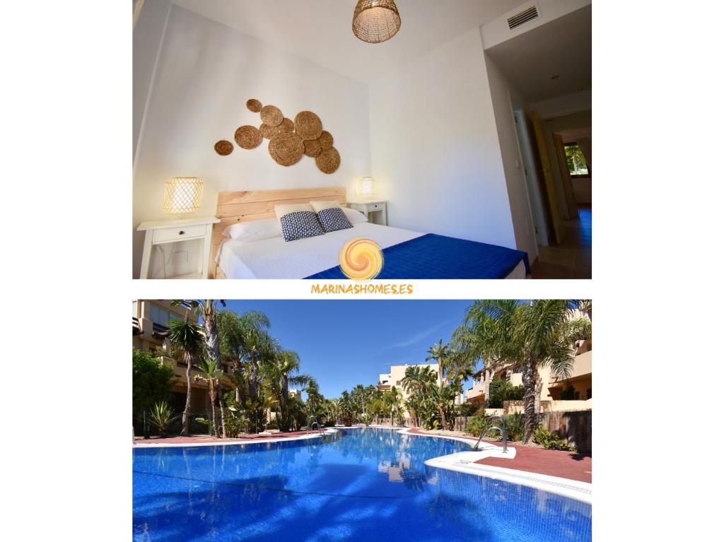 维拉Bahia Marinas - Tu hogar con jardín privado!的酒店客房带床和游泳池