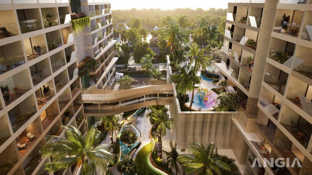 头顿CONDOTEL 5 SAO THE SÓNG VŨNG TÀU Mr VƯƠNG VIP的享有带游泳池和棕榈树的建筑的顶部景致