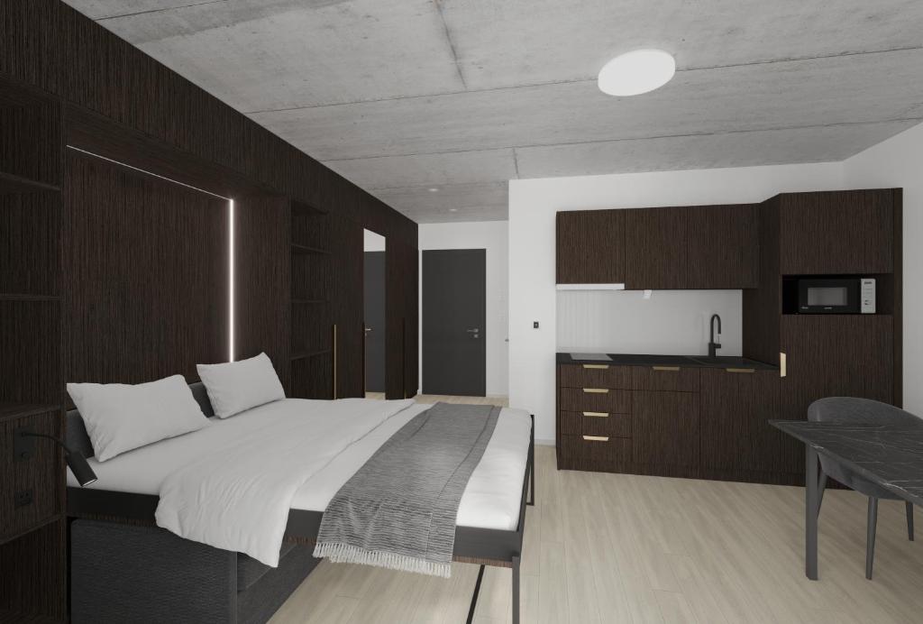 圣加仑MOOI Apartments St.Gallen的一间卧室配有一张大床和一张桌子
