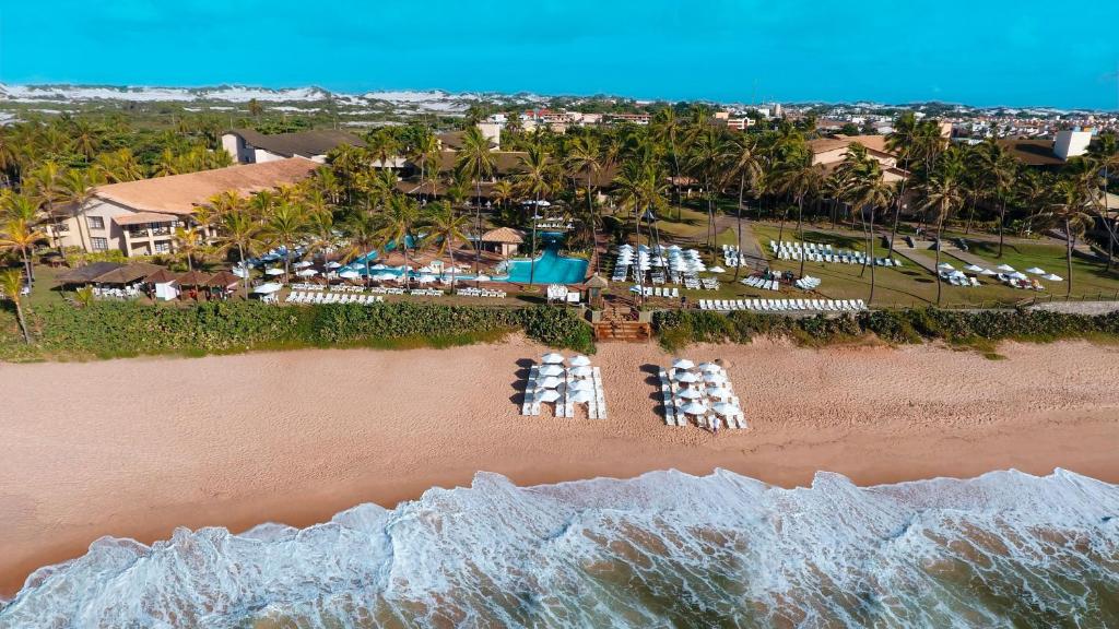 萨尔瓦多卡特萨巴度假酒店的享有海滩空中美景和度假胜地