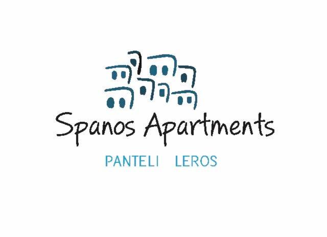 PanteliSpanos Apartments - Panteli的配件公寓的标志,附有建筑物图