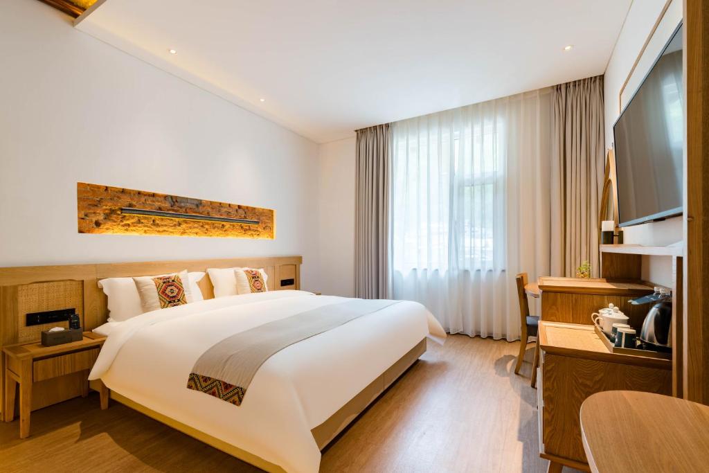 Yoba Boutique Hotel客房内的一张或多张床位