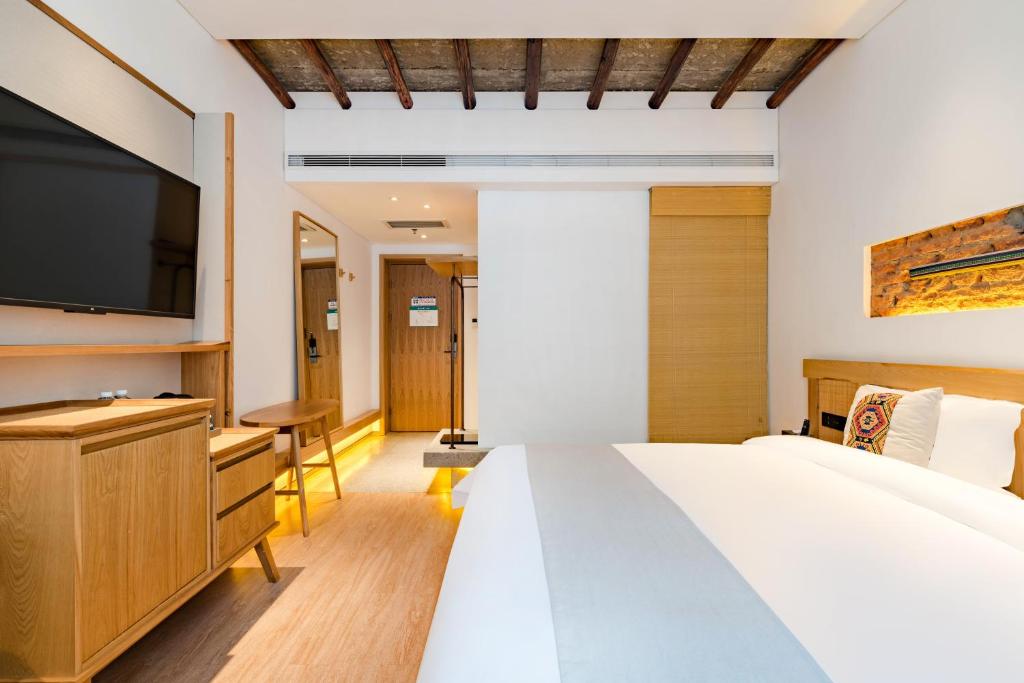 Yoba Boutique Hotel客房内的一张或多张床位