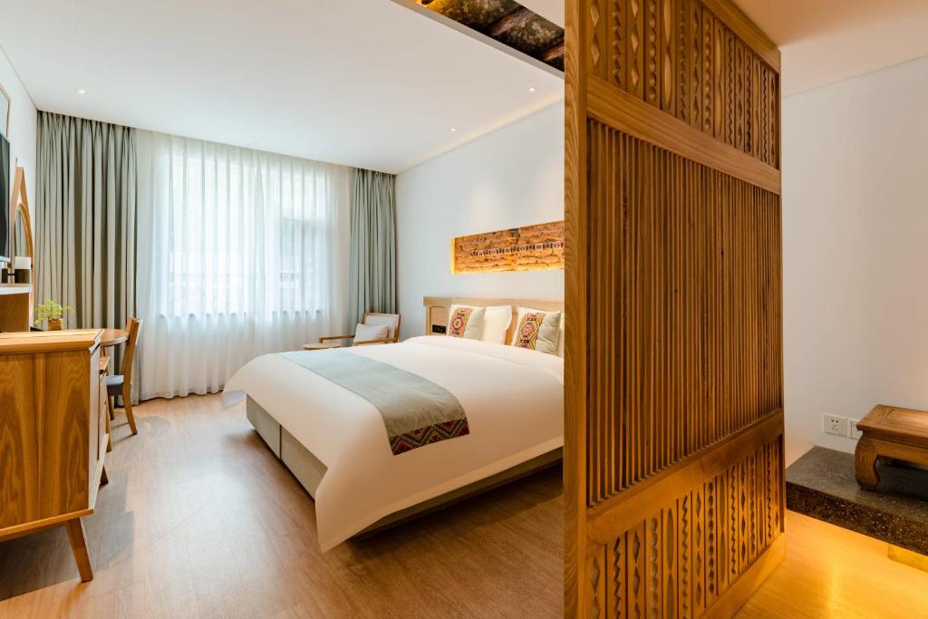 Yoba Boutique Hotel客房内的一张或多张床位