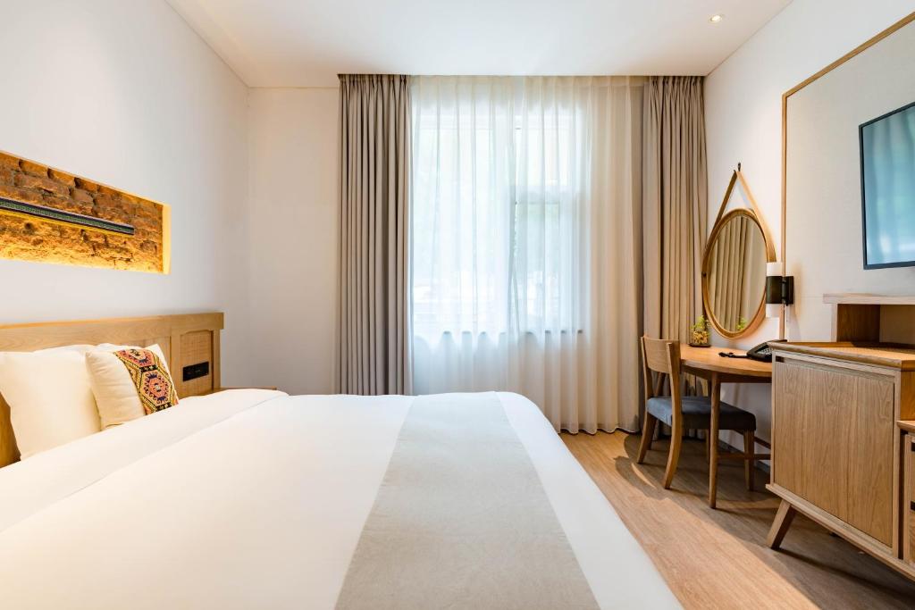 Yoba Boutique Hotel客房内的一张或多张床位