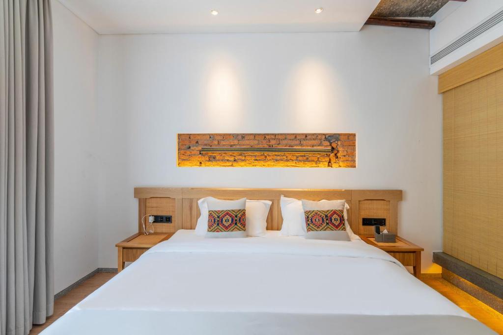 Yoba Boutique Hotel客房内的一张或多张床位