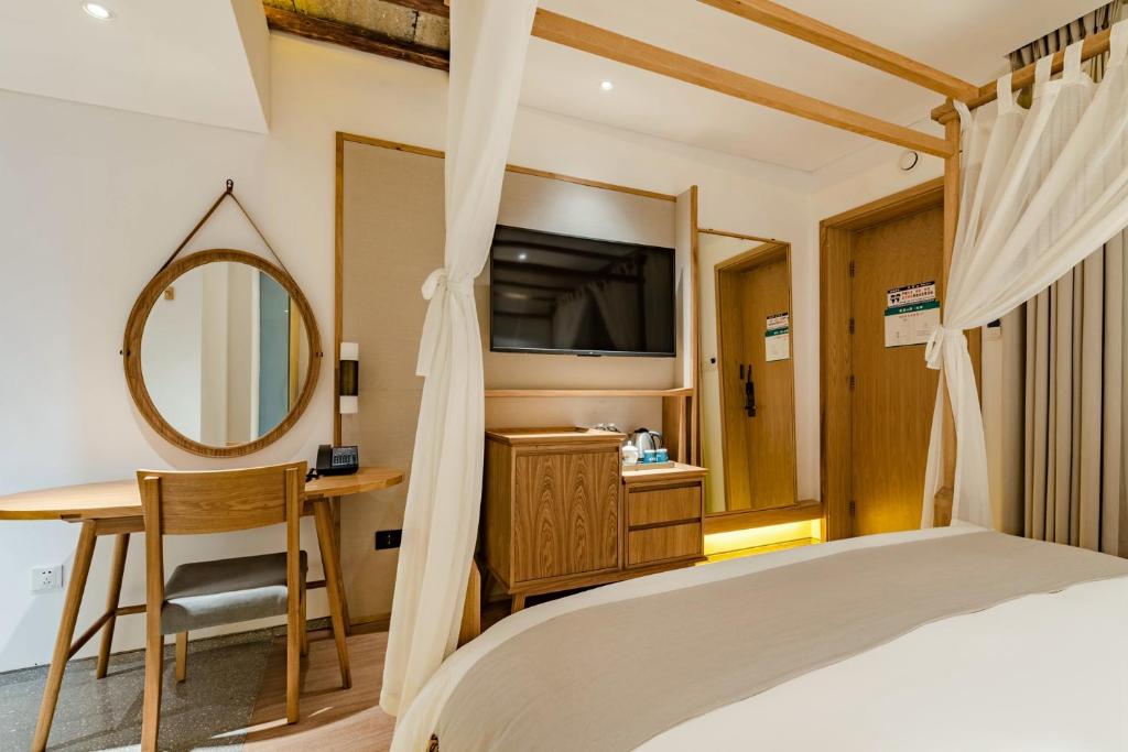 Yoba Boutique Hotel客房内的一张或多张床位