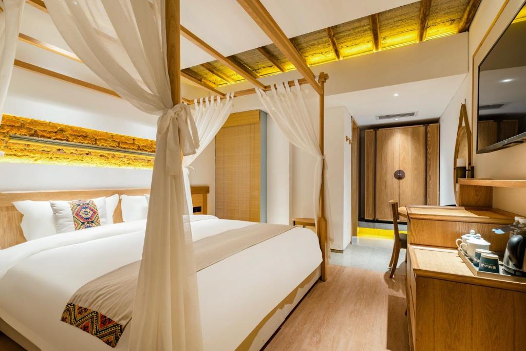 Yoba Boutique Hotel客房内的一张或多张床位