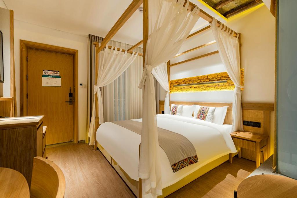 Yoba Boutique Hotel客房内的一张或多张床位