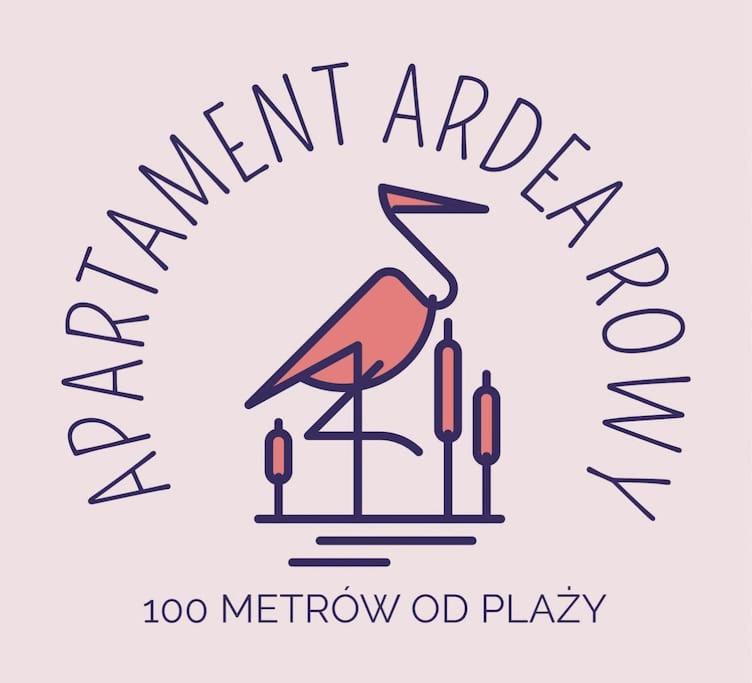罗威Apartament Ardea Rowy的鸟和酒杯活动的标志