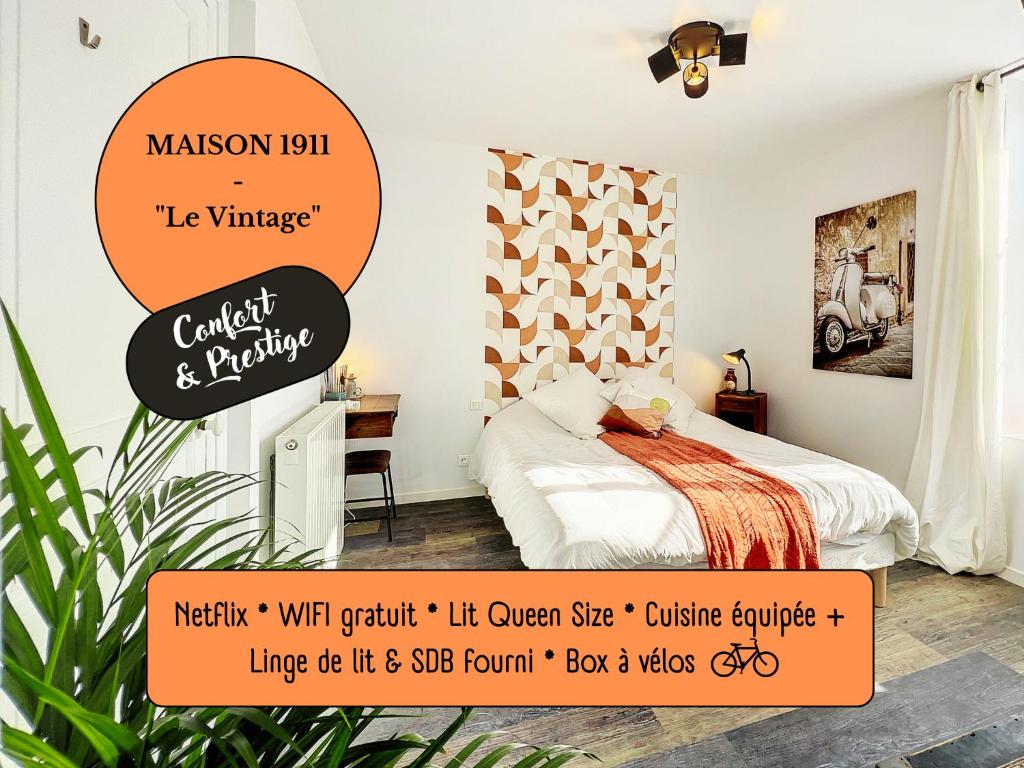 日安Studio LE VINTAGE - Maison 1911 - confort & prestige的一间卧室,配有一张橙色标牌的床
