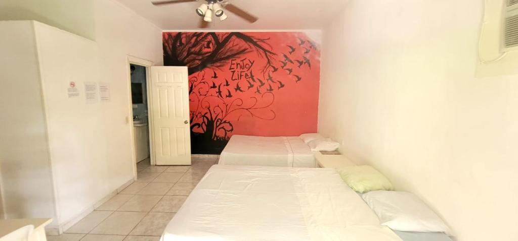 hotel trinidad客房内的一张或多张床位