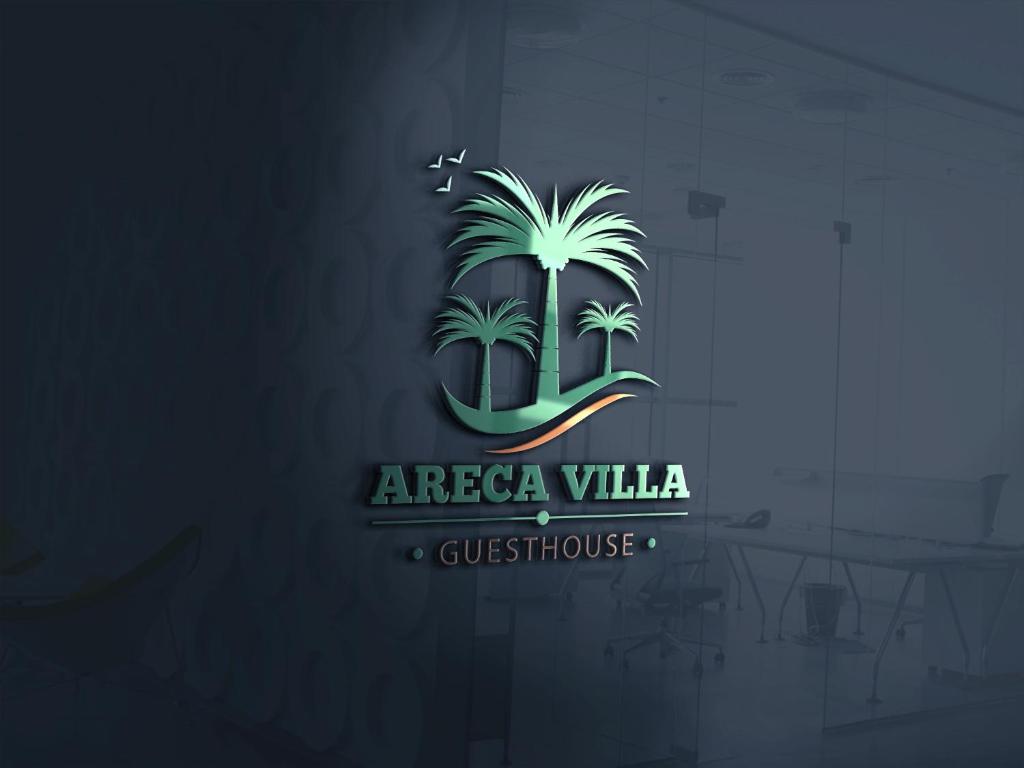 纽卡斯尔Arecavilla guesthouse的蓝底上的棕榈树标志
