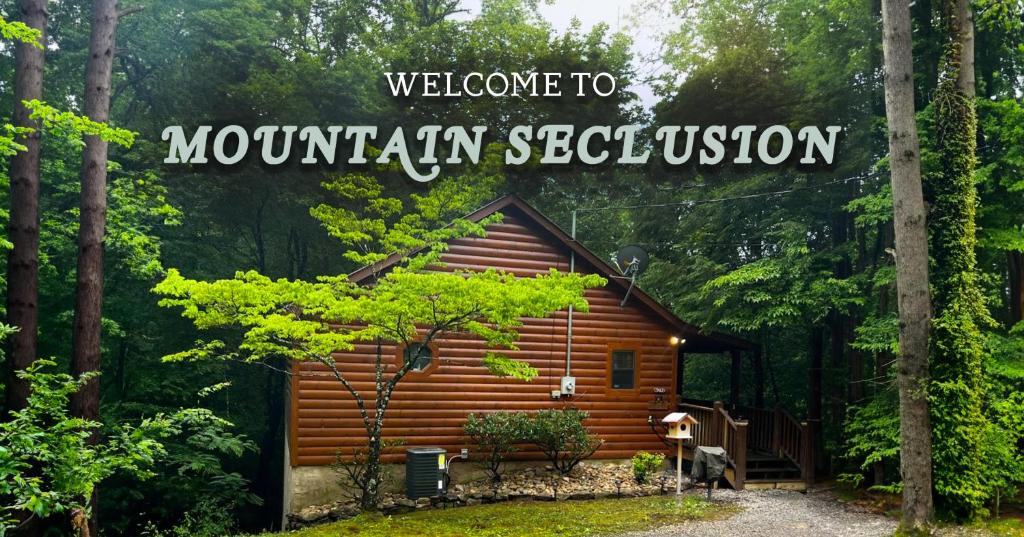 赛维尔维尔Mountain Seclusion的林中小屋,欢迎客人前来蒙塔纳隐居标志