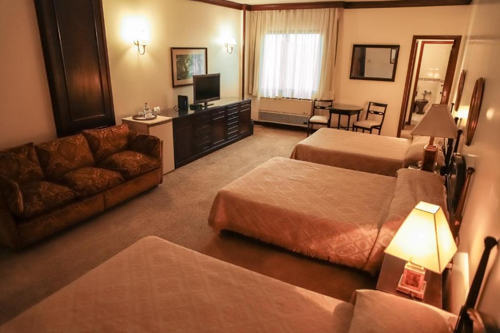 Nobile Suites Excelsior Asuncion客房内的一张或多张床位