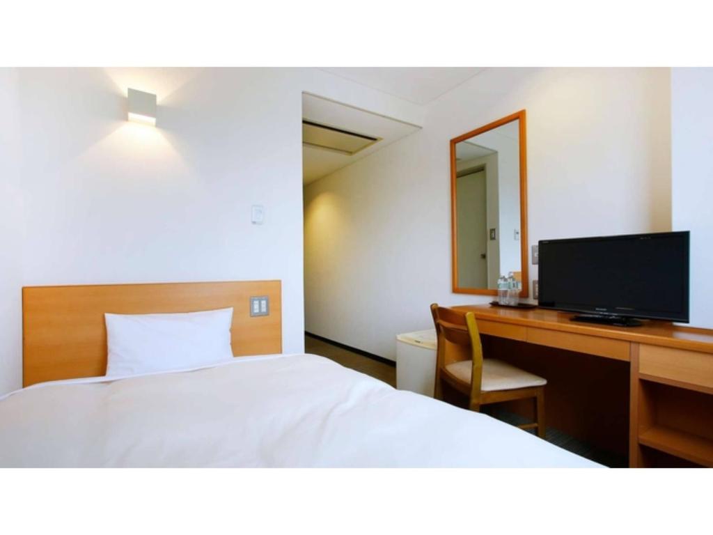 Miyakonojo City Hotel - Vacation STAY 15135v客房内的一张或多张床位