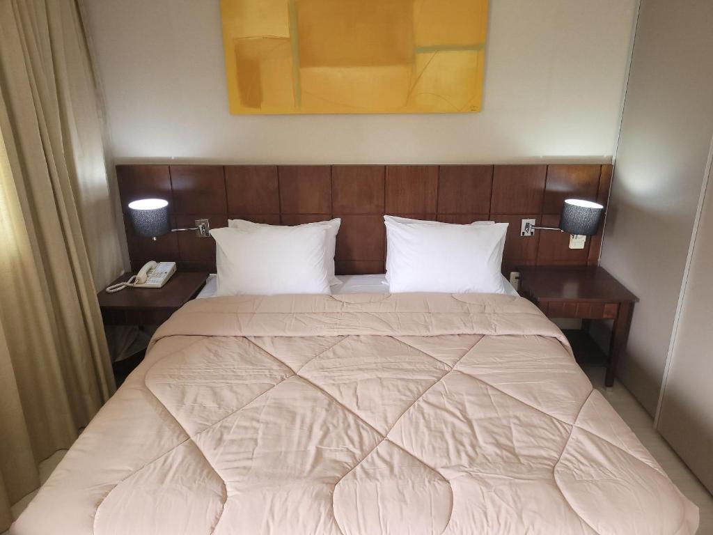 Flat Super Luxo Verbo Divino客房内的一张或多张床位