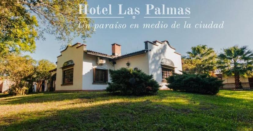 梅赛德斯Las Palmas的一座房子的形象,上面写着“棕榈酒店”