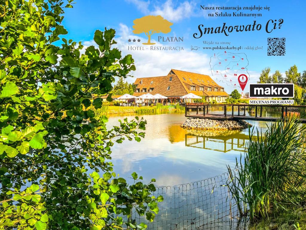 小波兰地区森济舒夫Hotel - Restauracja Platan的杂志封面,上面有房子和河流的照片