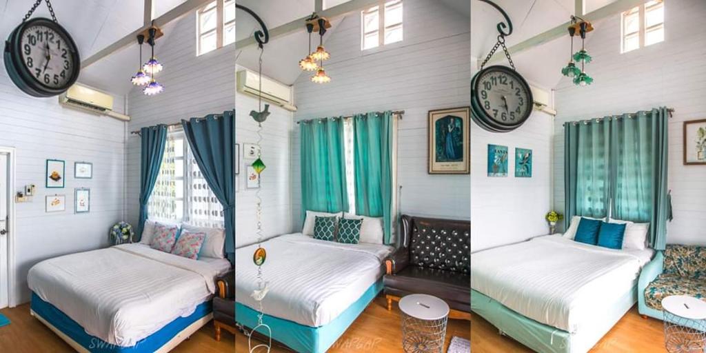 林信莱姆星白宫度假村的一间设有两张床的客房和墙上的时钟