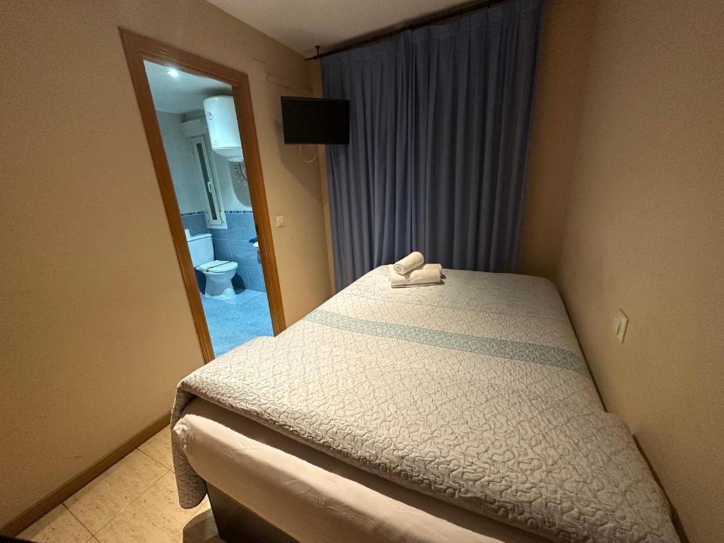 埃尔萨尔瓦多旅馆客房内的一张或多张床位