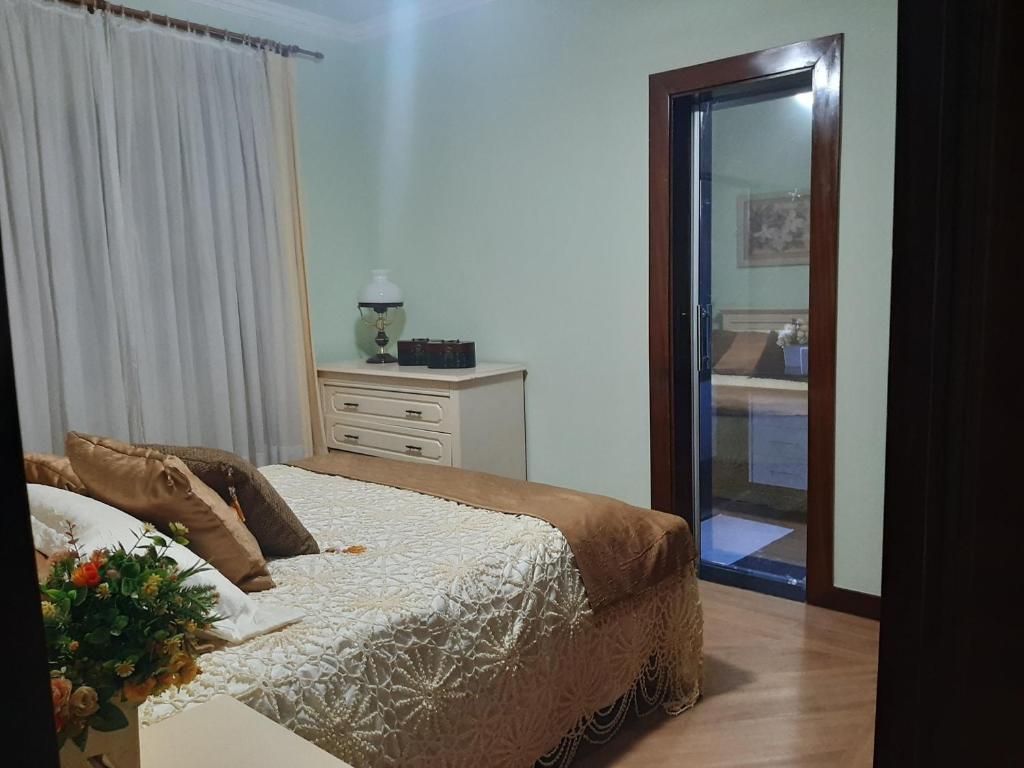 Espaço Aconchego客房内的一张或多张床位