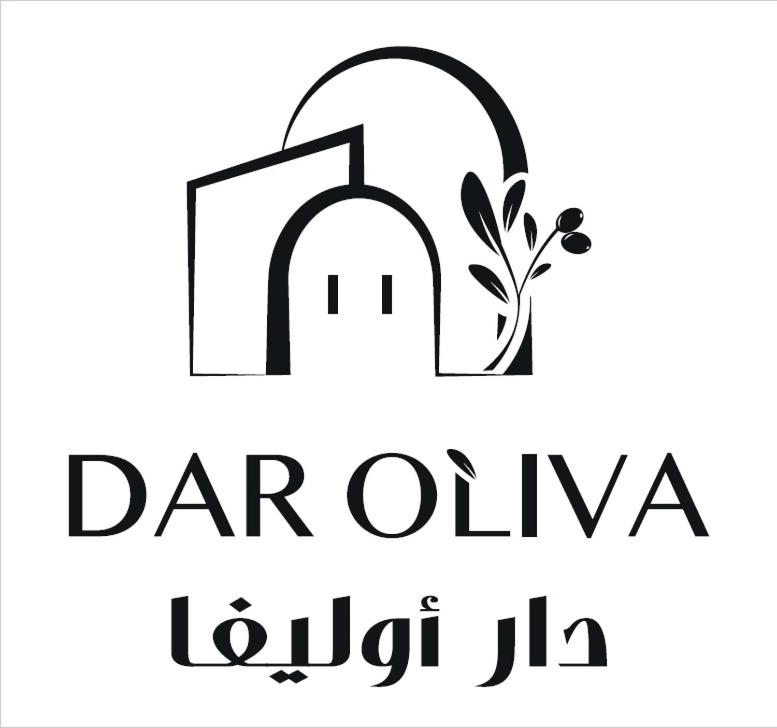 乌姆苏克Dar Oliva Maison de luxe的门和植物的标志