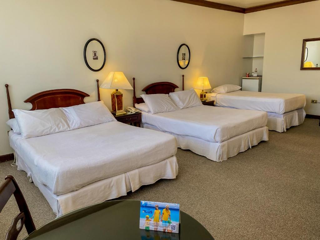 Nobile Suites Excelsior Asuncion客房内的一张或多张床位