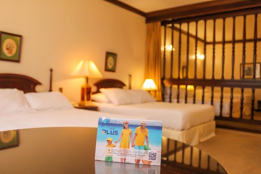 Nobile Suites Excelsior Asuncion客房内的一张或多张床位