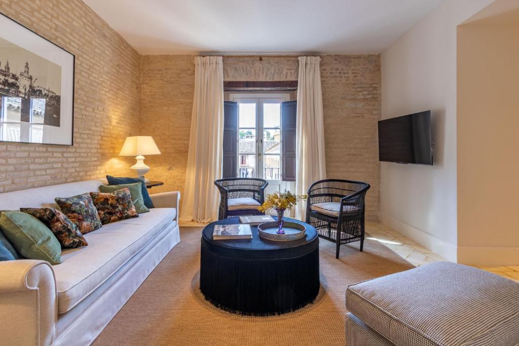 Casa de la Moneda Residences Sevilla客房内的一张或多张床位