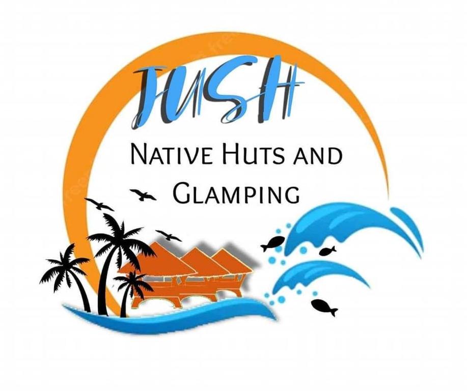 道伊斯JUSH NATIVE AND GLAMPING的灵气原生小屋和游戏标志