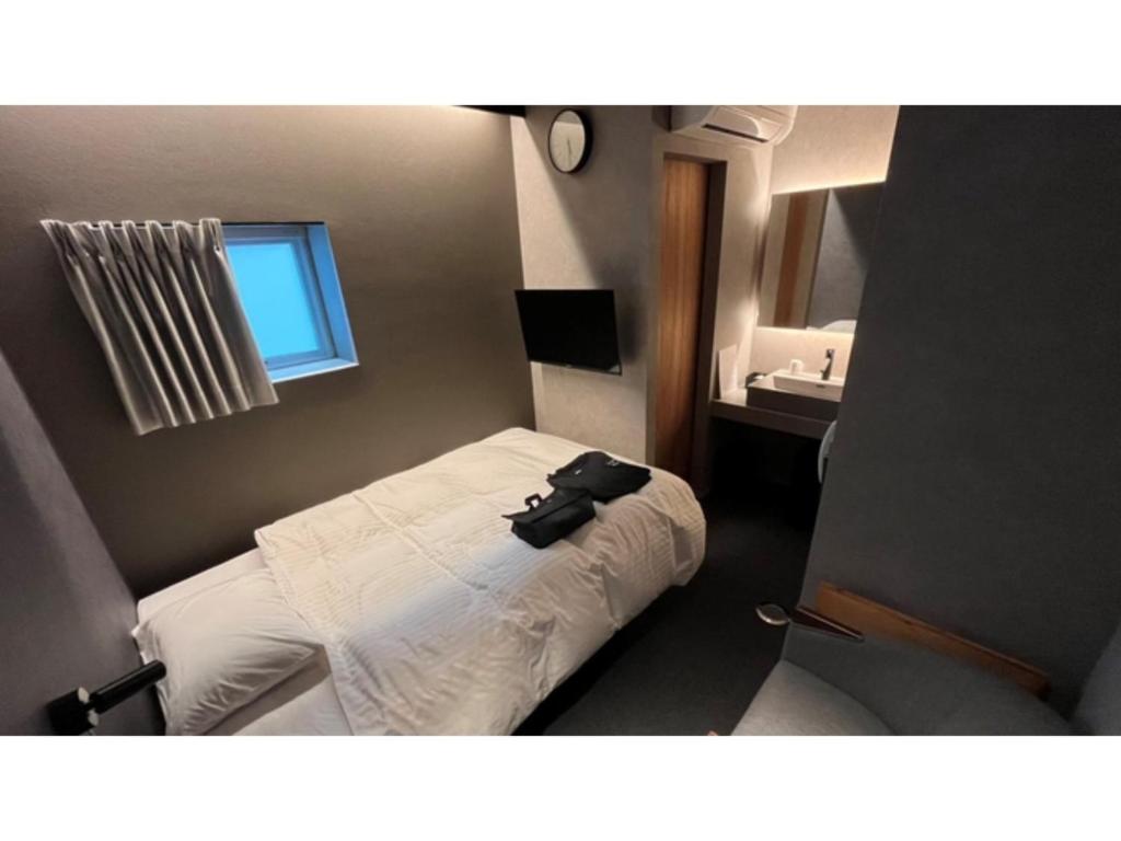 ＳＡＵＮＡ&ＳＴＡＹ - Vacation STAY 80248v客房内的一张或多张床位