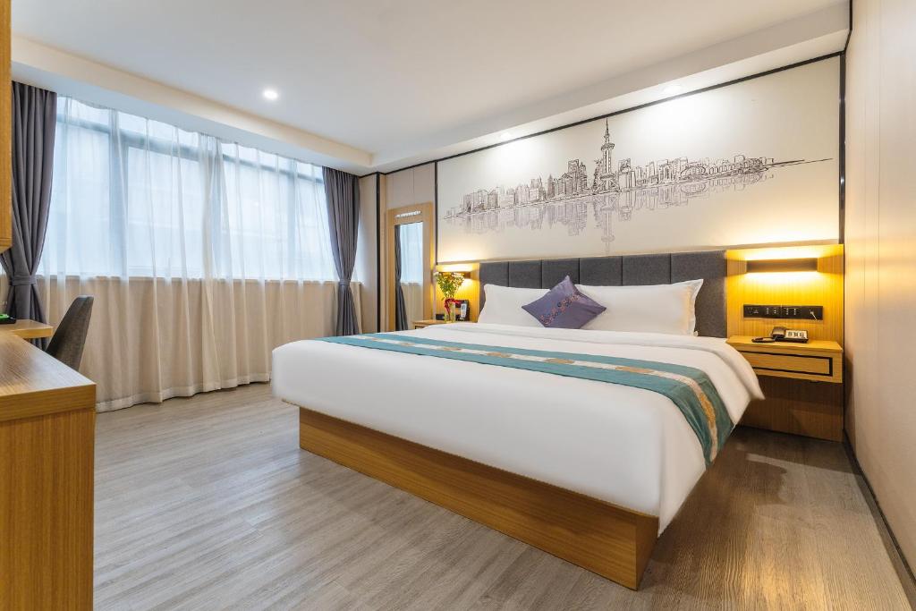 广州逸米米公寓(广州火车站西村地铁站店)的一间卧室,卧室内配有一张大床