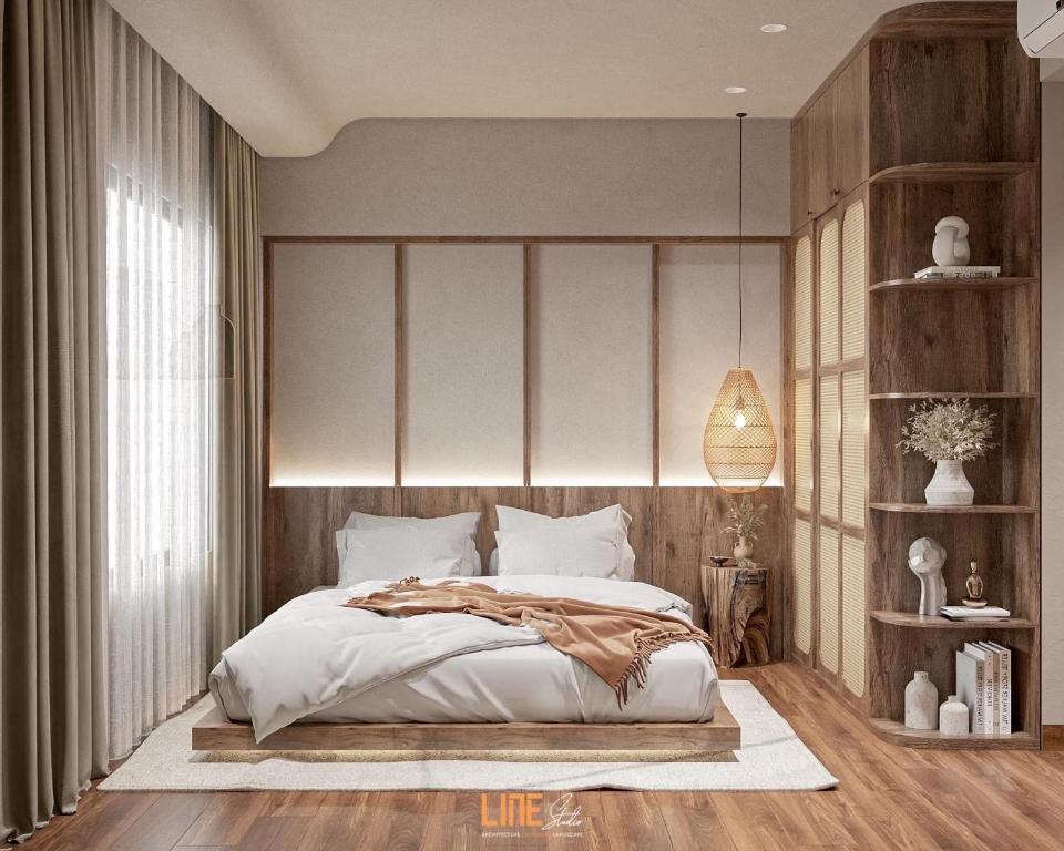归仁Hanie Apartment - FLC Sea Tower Quy Nhon的一间卧室设有一张大床和一个大窗户