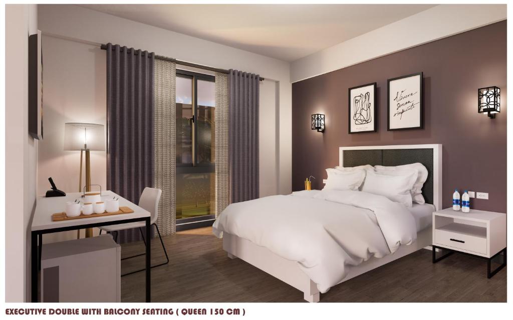 拉瓦格D'ELEMENTS HOTEL AND DORMITORY的卧室配有一张白色大床和一张书桌