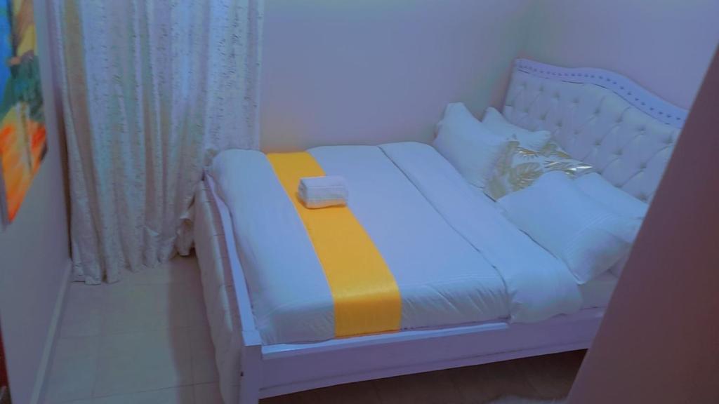 Kathy's Place in Runda客房内的一张或多张床位