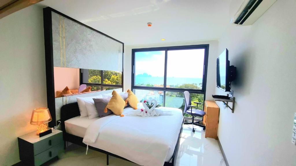 奥南海滩A404-nice Seaview One Bedroom At Ao Nang Beach的一间卧室设有一张床和一个大窗户