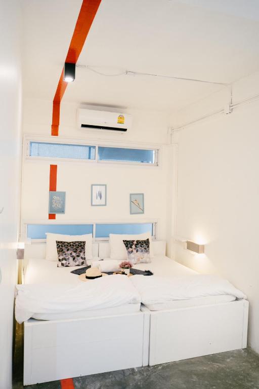 Qilombo Hostel Silom - HQ客房内的一张或多张床位