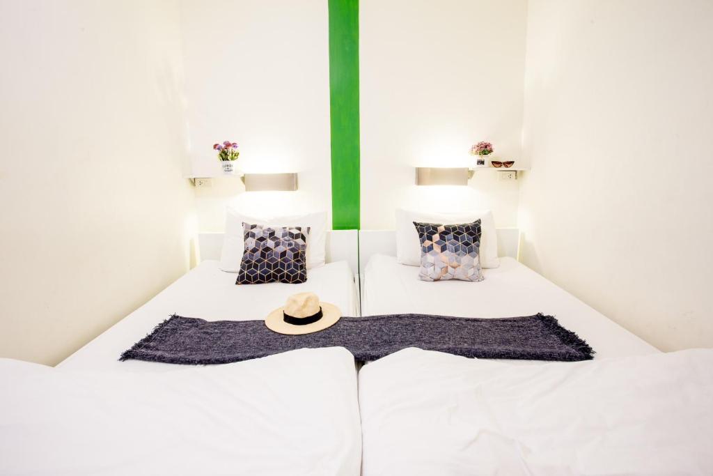 Qilombo Hostel Silom - HQ客房内的一张或多张床位