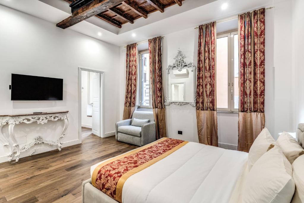 罗马RIPETTA234的一间卧室设有一张大床和一个壁炉