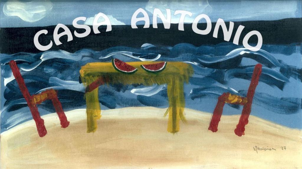圣胡安海滩Casa Antonio - apartamento Luna的一张桌子上的西瓜画
