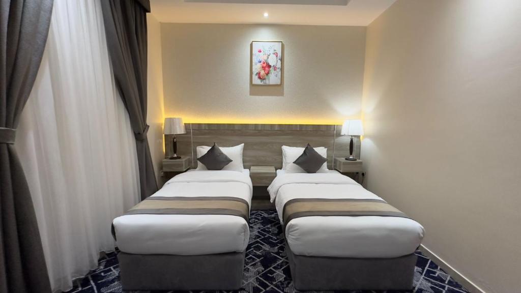 Jawharat Alia Apartment客房内的一张或多张床位