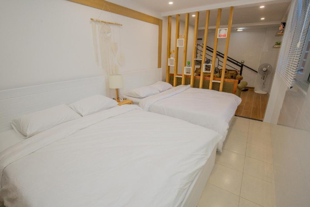 Suri Homestay客房内的一张或多张床位
